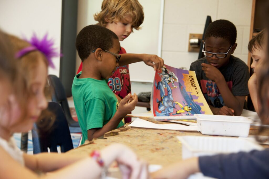 Children reading materials in classroom