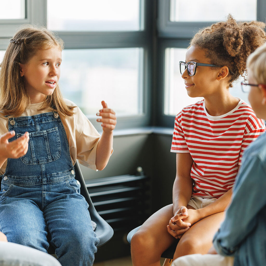 Social skills - students in room speaking together