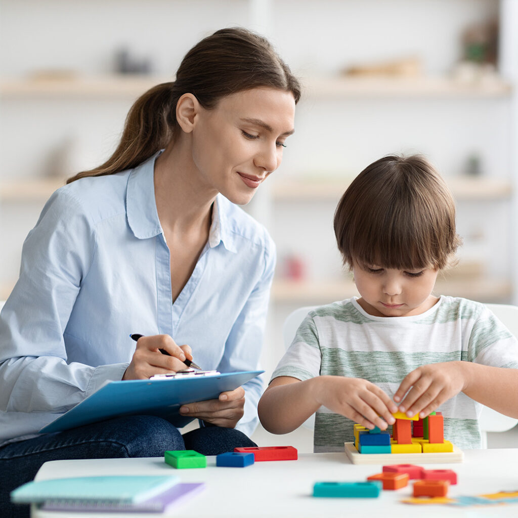 Occupational therapist working with student