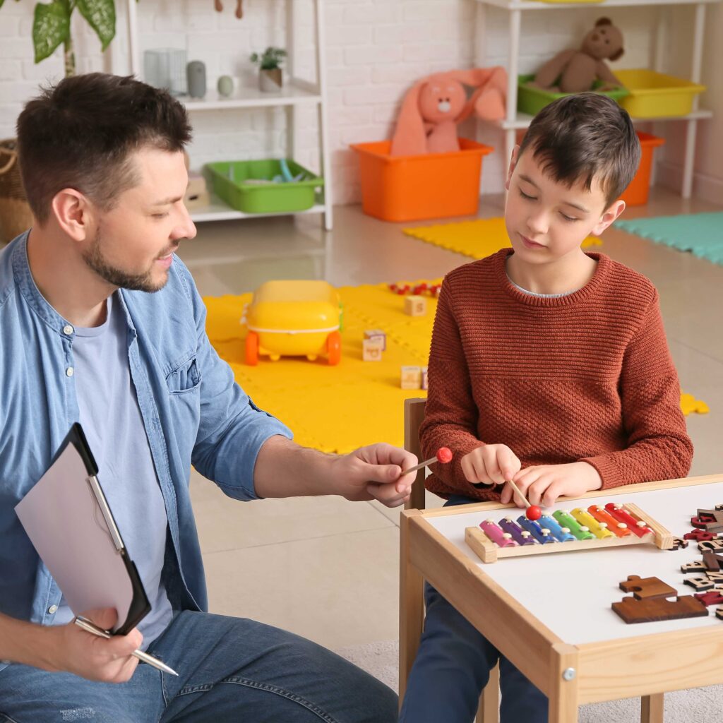 Man playing with musical instrument in in classroom